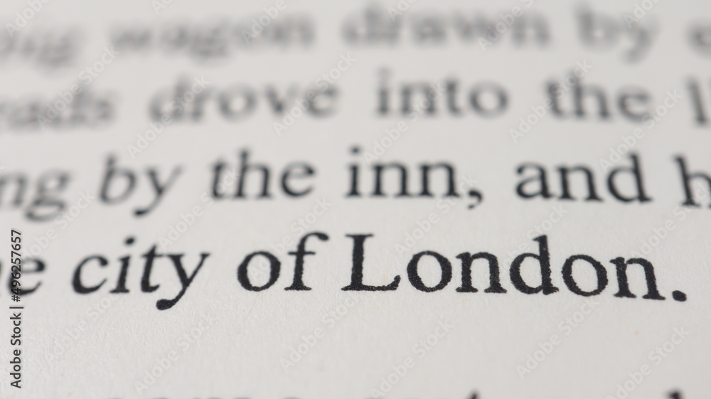 Obraz premium City of London text in open book page, close up, macro shot of London word, education and novel concept, selective focus