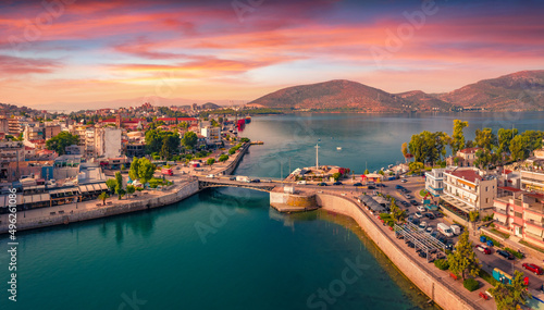 Fototapeta Naklejka Na Ścianę i Meble -  Splendid summer view from flying drone of Chalcis town with Chalkida's Old Bridge, Greece, Europe. Spectacular sunrise on Euboea island, Greece, Europe. Traveling concept background.
