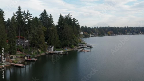 Waterfront Settlements With Wooden Jetty In Lakewood Neighborhood, Washington USA. Aerial Drone Shot photo