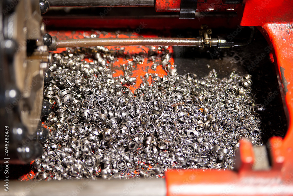 A lot of metal shavings close-up, after working on a milling machine or CNC machine. Texture metal shavings macro
