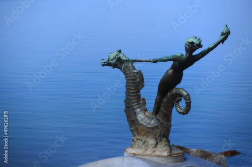 Nymph riding a seahorse sculpture on promenade along shore of Lake Geneva, Vevey, Vaud, Switzerland photo