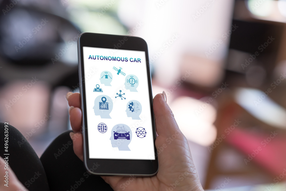 Fototapeta premium Autonomous car concept on a smartphone
