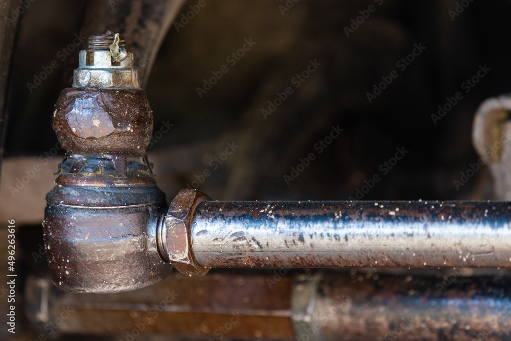 Close-up of the truck side tie rod end in the real case. The new tie rod end. Changing a new car spare part. Car spare parts Close-up of the truck side tie rod end in the real case. The new tie rod end. Changing a new car spare part. Car spare parts