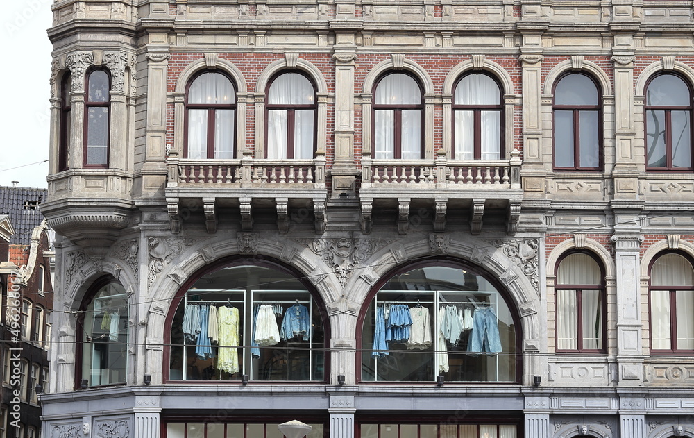 Amsterdam Dam Square Historic Building Facade Close Up with Clothing Hanging in the Windows, Netherlands
