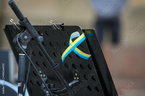 POLTAVA, UKRAINE - MARCH 31, 2022: Yellow and blue ribbon (symbol of Ukraine) during the concert - actions of Ukrainians to the world to close the skies over Ukraine for Russian aircraft on the Theate photo