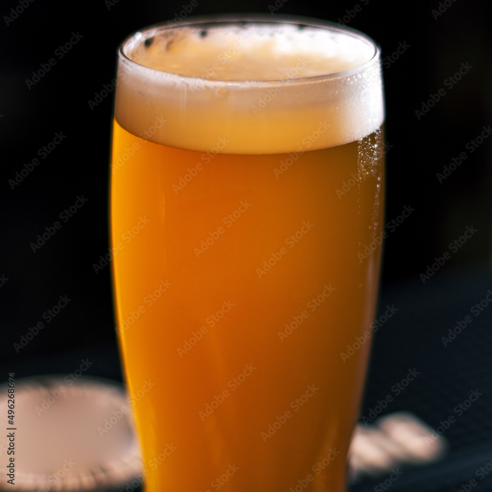glass od light craft beer on wooden table square glass od light craft beer on wooden table square