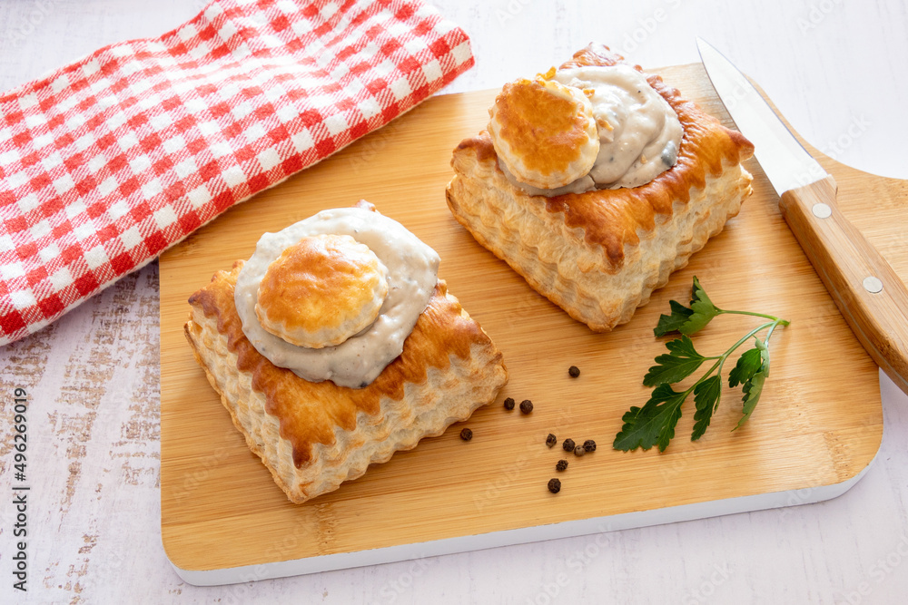 puff pastry garnished with veal rice on wooden board puff pastry garnished with veal rice on wooden board
