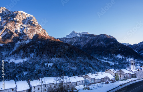 Little town in the mountains covered in snow in winter