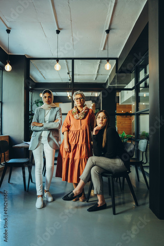 Diverse businesswomen looking at the camera in an office