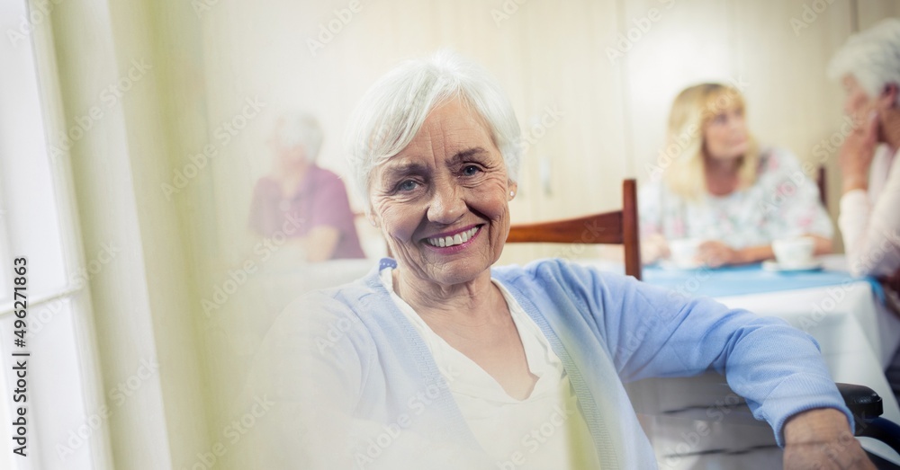 Blur effect with copy space against caucasian senior woman smiling at retirement home Blur effect with copy space against caucasian senior woman smiling at retirement home