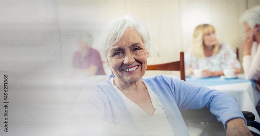 Blur effect with copy space against caucasian senior woman smiling at retirement home Blur effect with copy space against caucasian senior woman smiling at retirement home