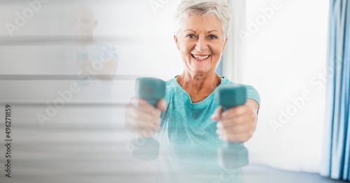 Blur effect with copy space against caucasian senior woman working out with dumbbells