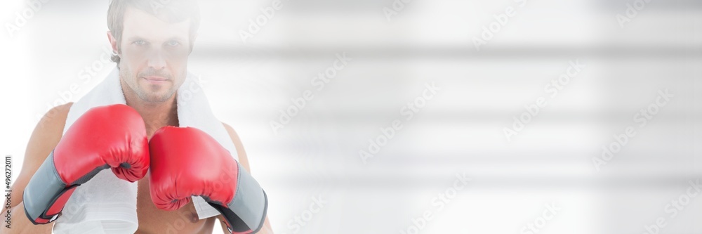 Blur effect with copy space against portrait of caucasian male boxer against grey background Blur effect with copy space against portrait of caucasian male boxer against grey background