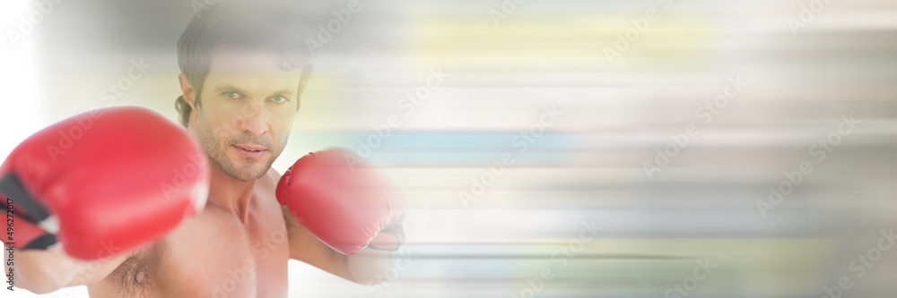 Blur effect with copy space against portrait of caucasian male boxer against grey background Blur effect with copy space against portrait of caucasian male boxer against grey background