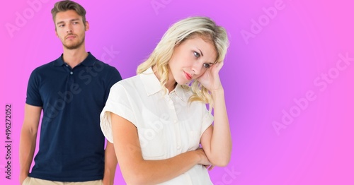 Sad caucasian couple after having an argument against purple gradient background