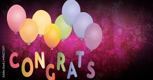 Congrats text tied to a bunch of colorful balloons against red wooden background