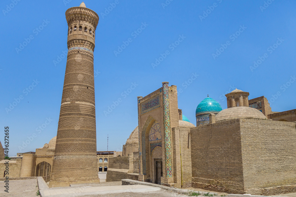 Kalyan Minaret (built in 1127) and Amir Alim Khan Madrasah in the historical center of Bukhara, Uzbekistan