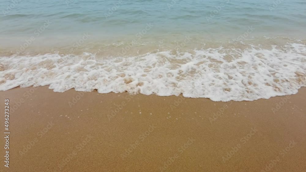 Waves of the sea on the sandy beach background in summer. Waves of the sea on the sandy beach background in summer.