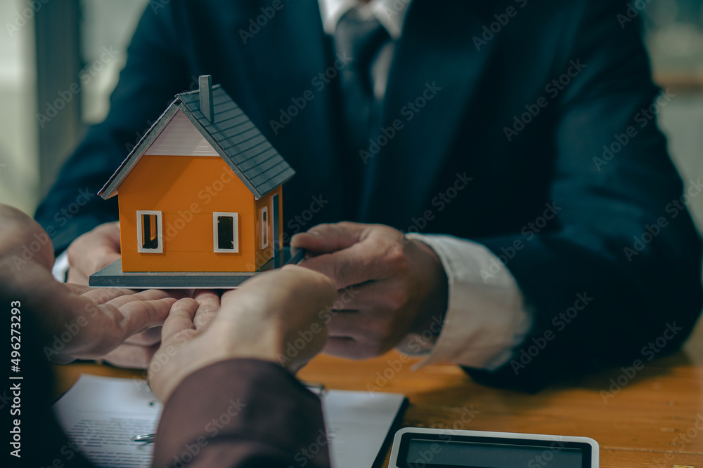 The salesperson describes an example of a house that is about to be built for the customer. Both installments and interest and contract documents in the real estate office business conversation ideas The salesperson describes an example of a house that is about to be built for the customer. Both installments and interest and contract documents in the real estate office business conversation ideas
