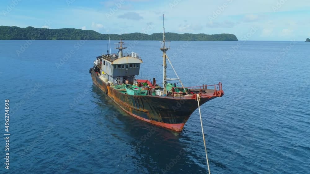 Illegal Chinese fishing vessel at anchor in Koror harbour after it was apprehended by patrol boat in Palau Illegal Chinese fishing vessel at anchor in Koror harbour after it was apprehended by patrol boat in Palau