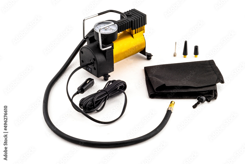 Car auto air compressor for travel isolated on white background Car auto air compressor for travel isolated on white background