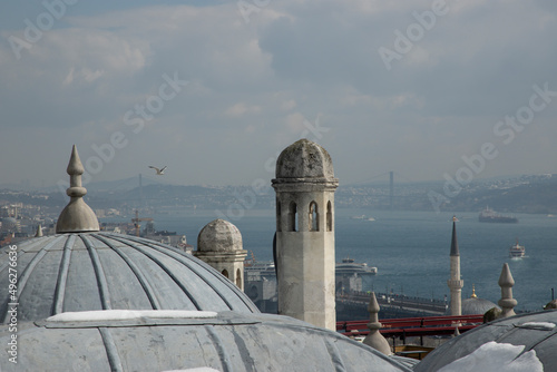 Istanbul view from Suleymaniye Mosque. Soggy weather. Selective focus on dome.