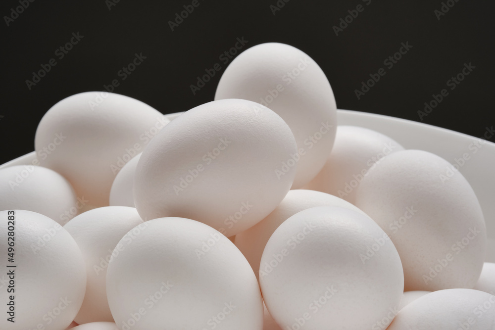 Heap of white whole eggs in a bowl. Shallow depth of field Heap of white whole eggs in a bowl. Shallow depth of field