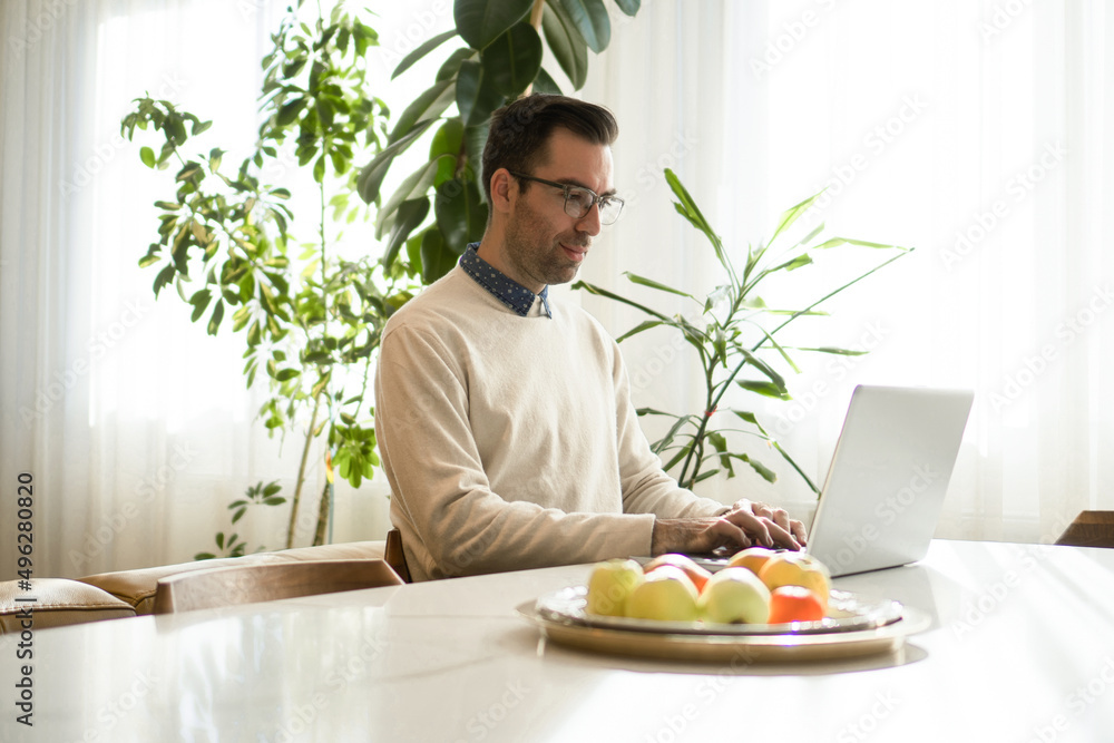 A dedicated man works from home A dedicated man works from home