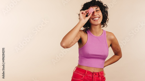 Modern woman holding a menstrual cup in her hand photo