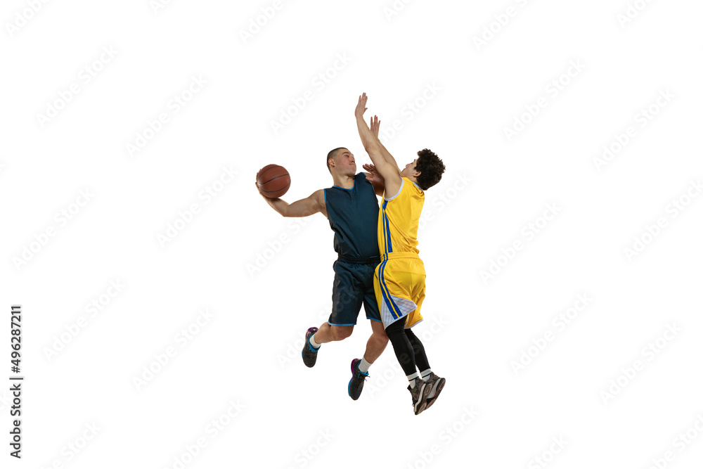 Top view of two young basketball players training with ball isolated on white studio background. Motion, activity, sport concepts.