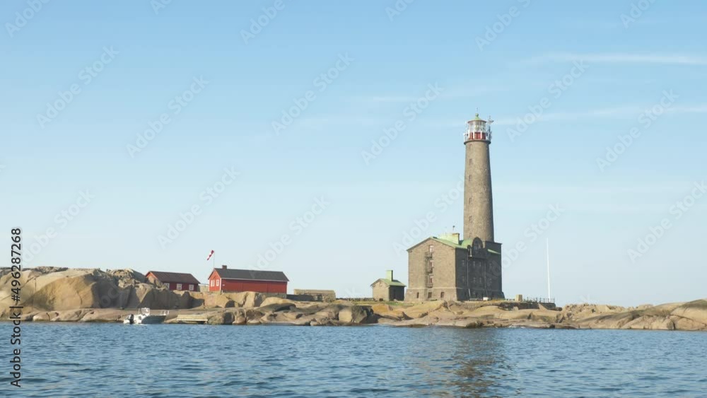 Historical lighthouse Bengtskar in southern Finland filmed from the sea on a calm and sunny day Historical lighthouse Bengtskar in southern Finland filmed from the sea on a calm and sunny day