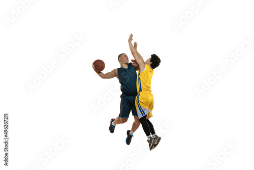 Top view of two young basketball players training with ball isolated on white studio background. Motion  activity  sport concepts.