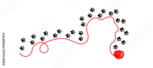 ślady kota podążające z czerwonym, rozwiniętym kłębkiem wełny, tropy zwierząt, kota, psa photo