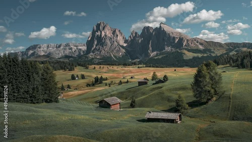 Timelapse of Rifugio Auronzo mountain hut during day in front of Dolomite Alps mountains at Three Peaks in Italy, clouds in sky
