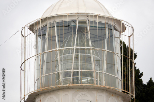 The light structure of a lighthouse. The Fresnel lens inside the lighthouse.