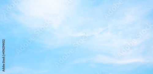 Fototapeta Abstract white puffy clouds and blue sky background.