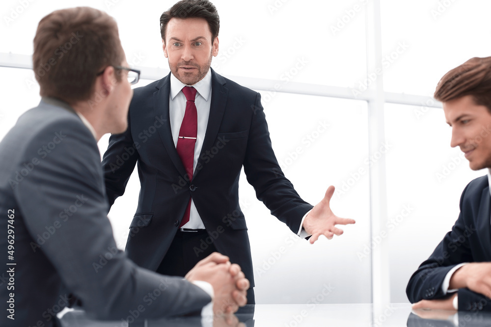 Fototapeta premium businessman talking with employees at a working meeting