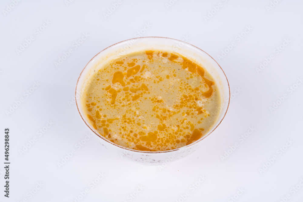 Cropped view of lentil soup shot from opposite or side view on isolated white background. Cropped view of lentil soup shot from opposite or side view on isolated white background.