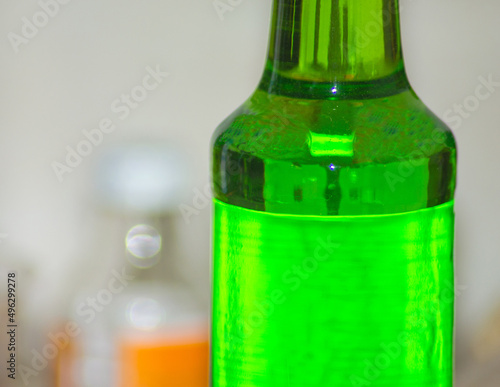 a bottle of melon flavored green syrup in the room. Drinks that are suitable for the month of Ramadan. Selective focus, detailed photo
