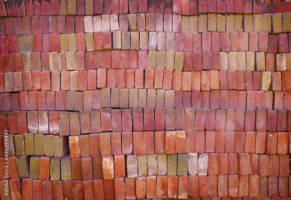 stacked red bricks textured background with vignette stacked red bricks textured background with vignette