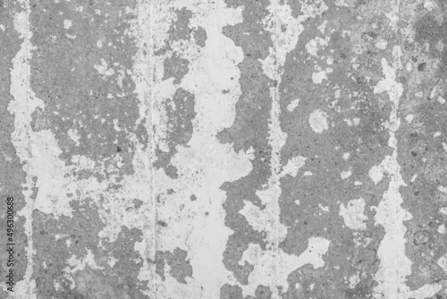White peeling paint from old concrete surface worn weathered cement wall texture background © Andrey