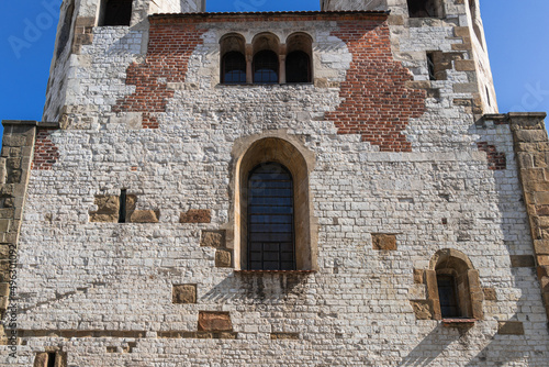 Facade, close-up of a medieval wall with windows of the Catholic Church in Old Krakow on a sunny day © Александр Бочкала