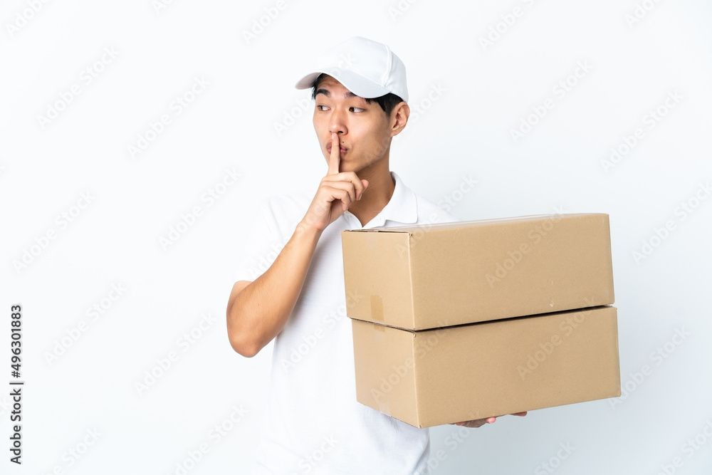 Delivery Chinese man isolated on white background showing a sign of silence gesture putting finger in mouth Delivery Chinese man isolated on white background showing a sign of silence gesture putting finger in mouth