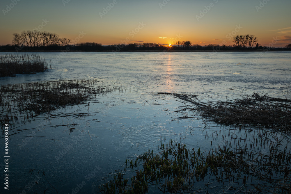 Evening view of an icy lake during sunset, Stankow, Poland