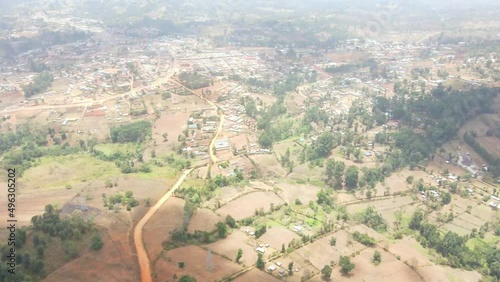 aerial drone view of red dirt road in kamatira, west pokot, kapenguria, Kenya. traditional rural community in Kenya Africa photo