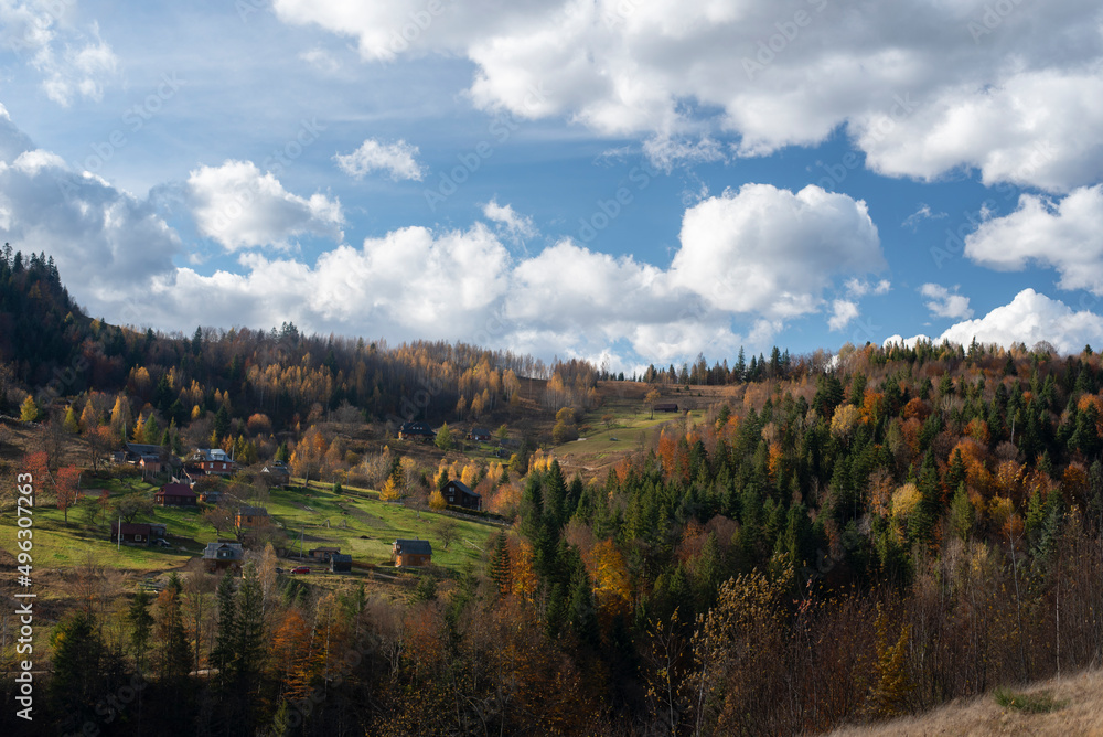 Naklejka premium Amazing mountains village panorama during the golden hour on a beautiful October day. The shot was made in Ukraine