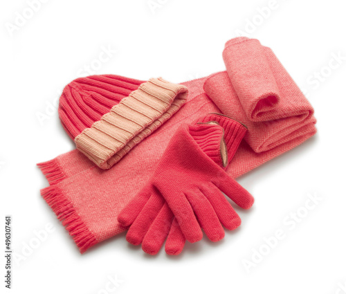 soft pink scarf with gloves and cashmere wool hat on white background
