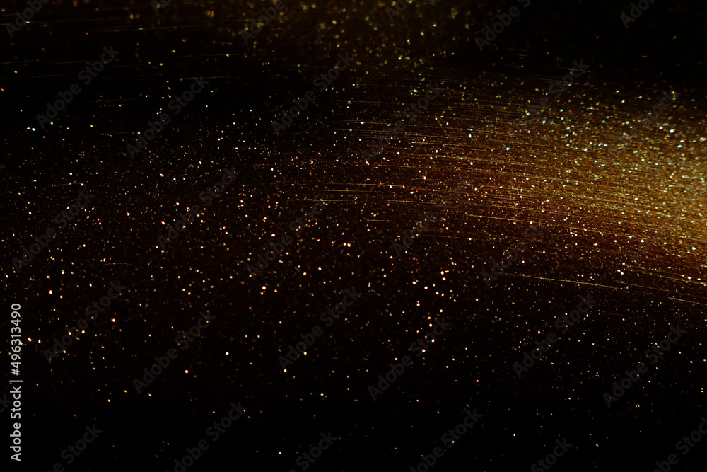 background of abstract glitter lights. gold and black. de focused background of abstract glitter lights. gold and black. de focused