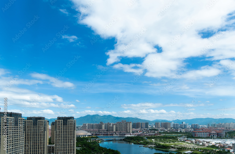 Modern city under cloudy sky