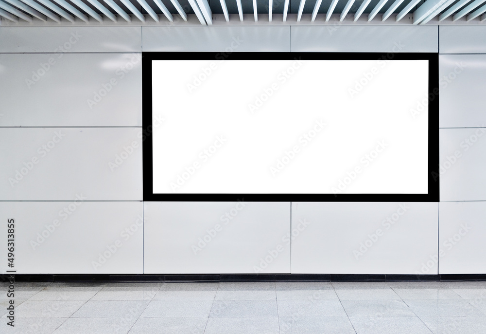 Blank billboard on the wall of underground hall Blank billboard on the wall of underground hall